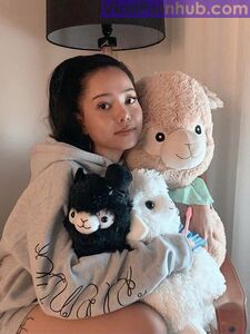 Bella Poarch Hugging her alpacas