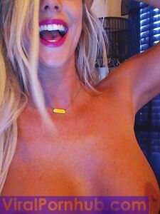 Smiling Blonde Chick Xo Gisele Is Playing With Her Enormous Boobs Before The Camera