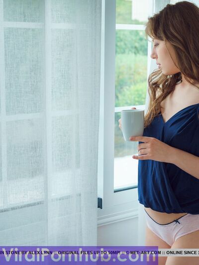 Young looking solo girl Satin Stone touts her nice ass after getting naked